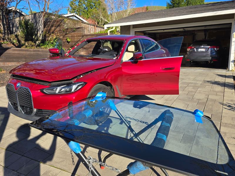 BMW iX windshield on stand ready for installation in Palo Alto